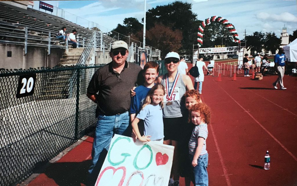 family at the finish line of a marathon